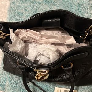 Michael Kor’s satchel black leather and gold hardware removable shoulder